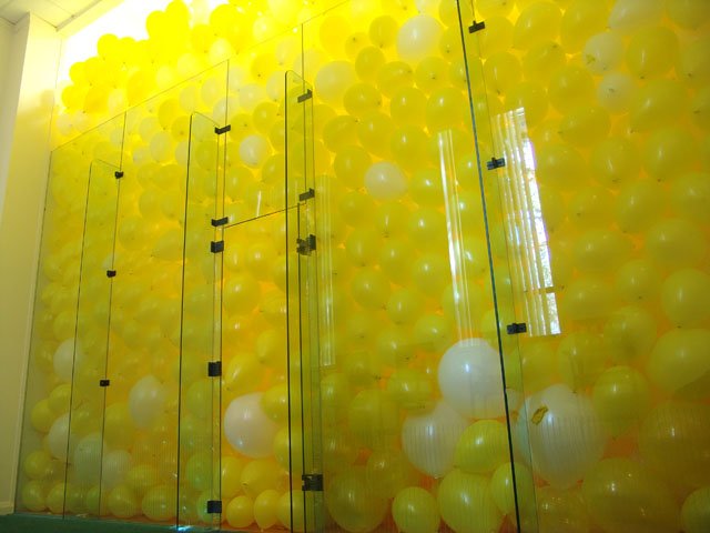 racquet ball court filled with balloons